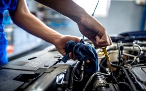 Person working on a car.