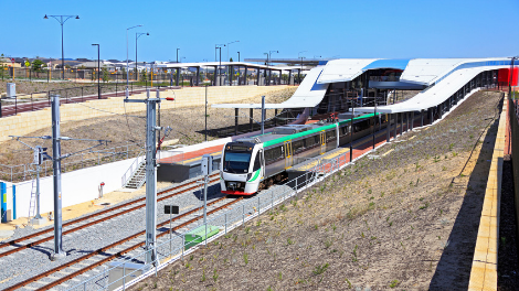 A train leaves Butler Station.