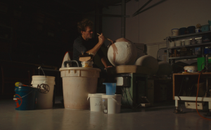 Man painting art display