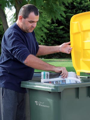 Man putting recycling in bin