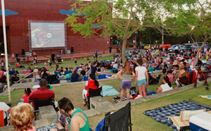People watching an outdoor cinema