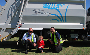 Boy meeting garbage drivers