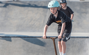 Boy on scooter at park