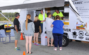 People with coffee at caravan