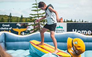 Child on mechanical surfboard