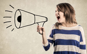 Teenager holding megaphone