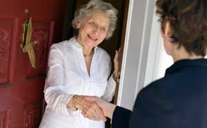 Senior lady shaking hands with neighbour