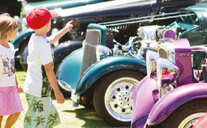 Children looking at classic cars