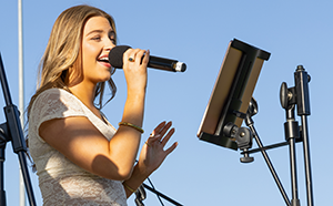 Girl singing on stage