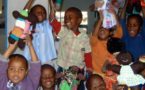 Children playing with Uthando dolls