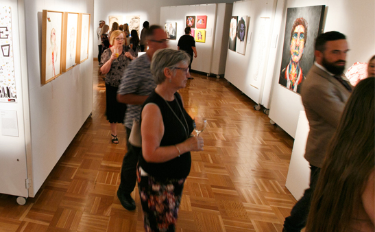 People at gallery exhibition