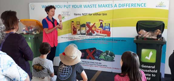 Waste education officers and group of residents
