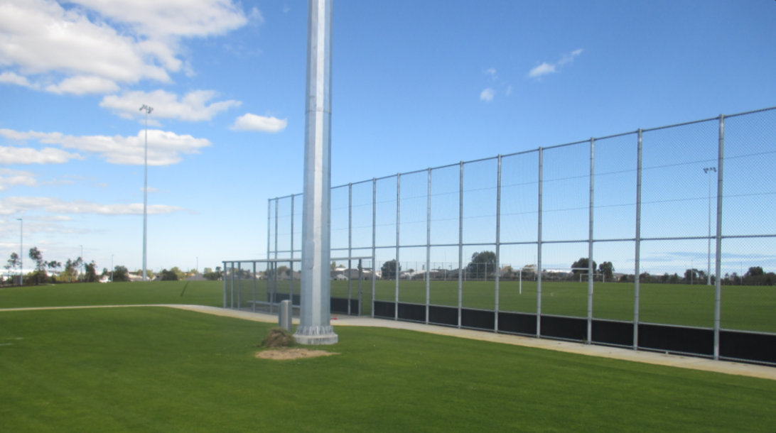 Baseball backnets adjacent Southern oval