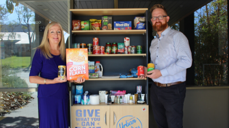 Wanneroo Mayor Tracey Roberts meets with volunteer Tim Nickoll to make a donation to the Wanneroo Urban Pantry.