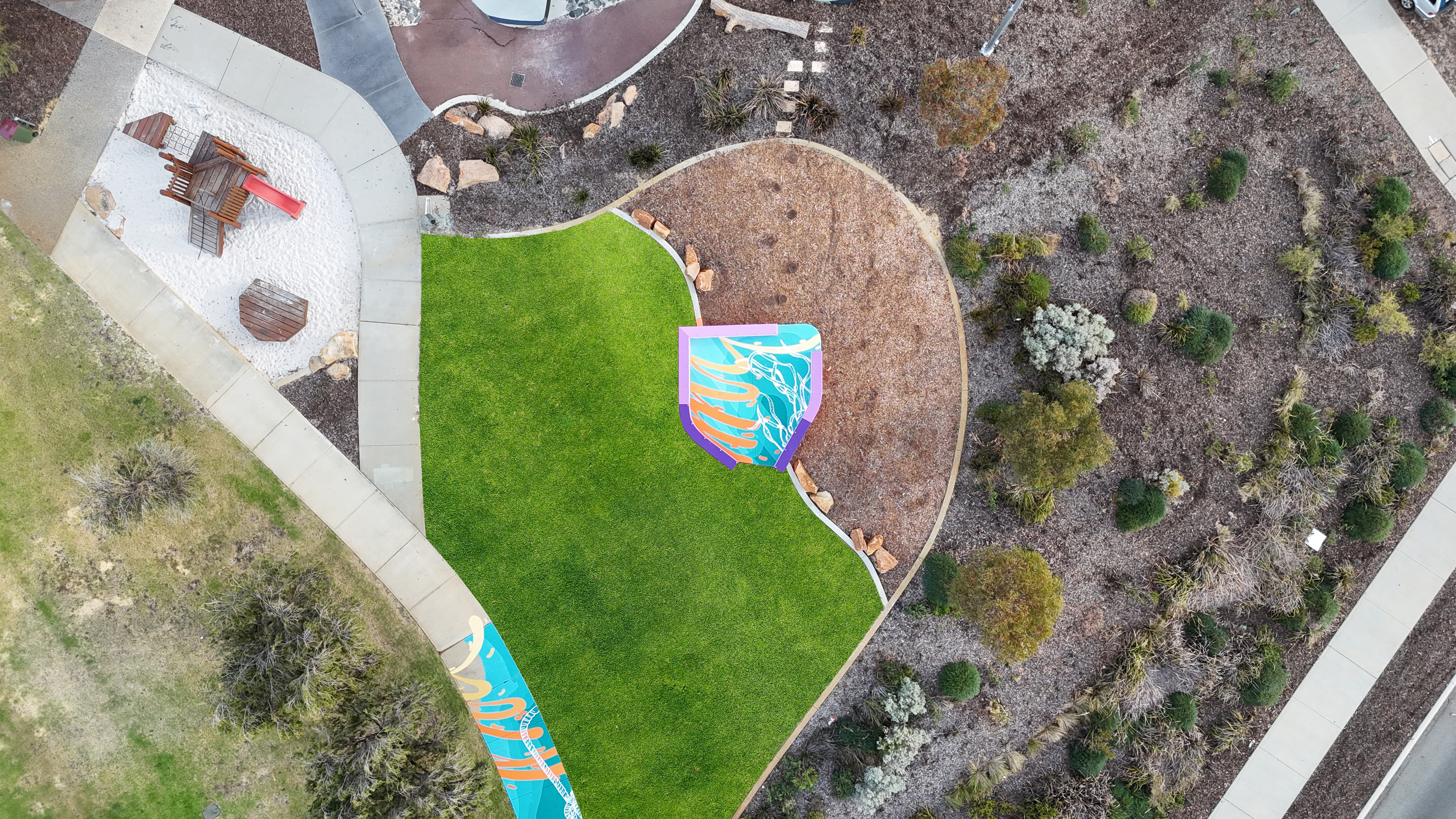 Aerial of youth mural in park.