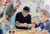 Grandparents with children at library