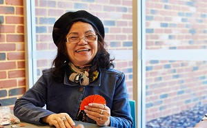 Woman smiling with playing cards in hand