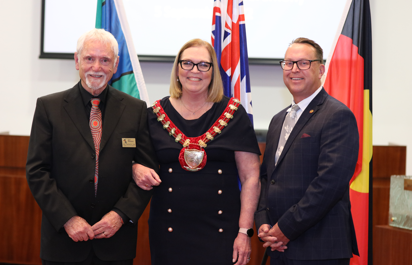 Freeman of the City Bill Marwick OAM, Mayor Linda Aitken and City of Wanneroo CEO Daniel Simms stand side by side for a photo in the Council Chambers