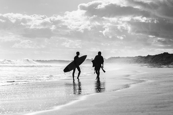 Surfers on beach