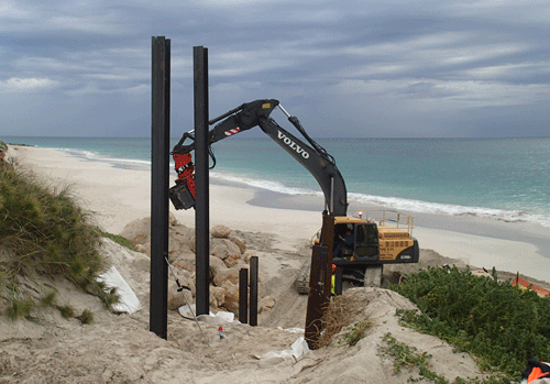 Pilings in sand