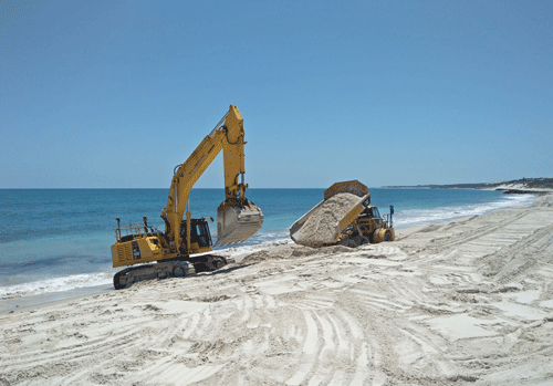 Excavator on beach