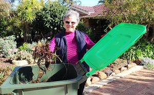 Hocking resident Joan Day with her new lime-green lid Garden Organics (GO) bin.