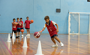 Children playing indoor basketball