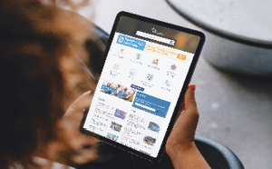 Person holding a tablet looking at the City of Wanneroo website