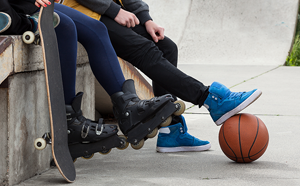 People at skate park with basketball