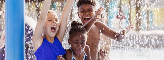 Children playing in water playground