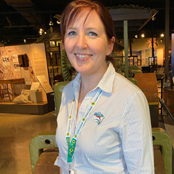 Staff member with sunflower support lanyard