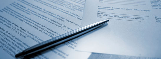 Pen and contract paperwork