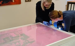 People viewing a piece of Andy Warhol art.