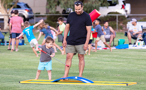 Man and child playing in park 