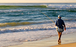 Man fishing on beach