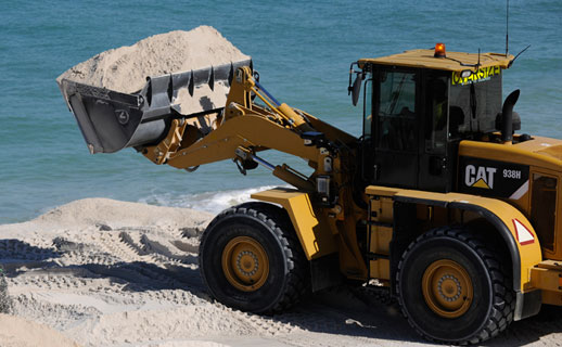 Excavator on beach