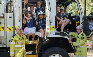 Children sitting in fire truck.