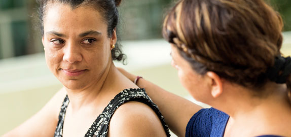 Woman giving help to woman