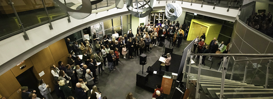 Crowd of people at exhibition opening