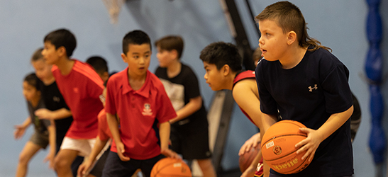 Children playing basketball