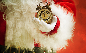 Image of Santa Claus holding a clock