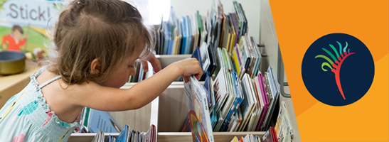 Girl looking for books in a library