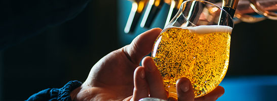 Beer being poured into a glass