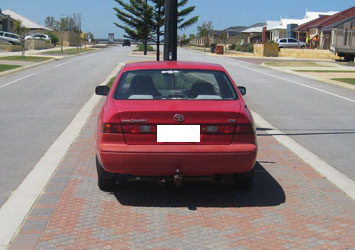 Car parked on median strip