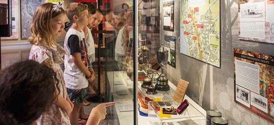 People viewing exhibits in museum