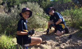 Two children planting