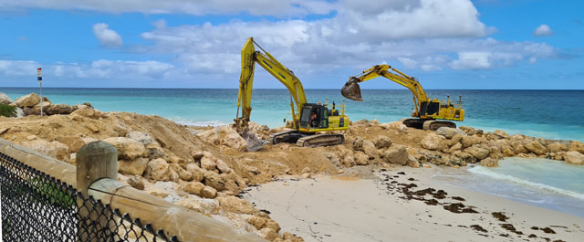 Excavators on beach