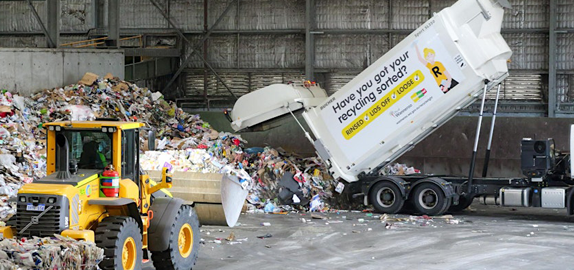 Image of recycling truck at waste facility