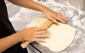 Person rolling dough