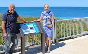 Wanneroo Mayor Tracey Roberts with George Bartell, owner of The Shore Café, in
front of the newly installed signage at Alkimos. Mr Bartell was instrumental in getting the
shipwreck signage project underway.